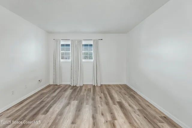 a view of a bathroom with a shower and a sink