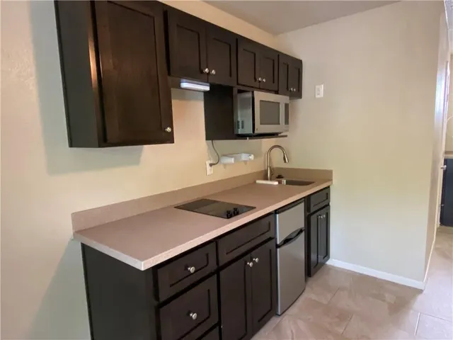 a kitchen with a sink and a cabinets
