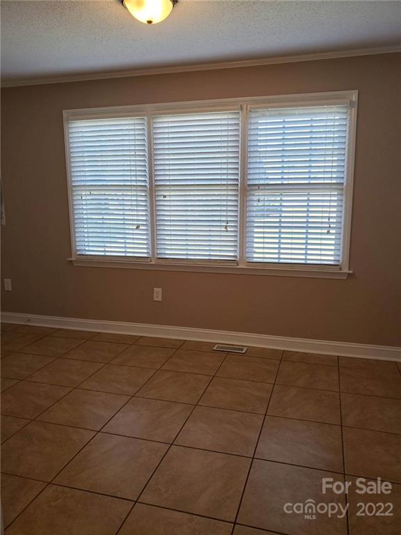 5418 East Lawyers Road Wingate, NC 28174 - Photo 16 of 40 a view of an empty room with a window