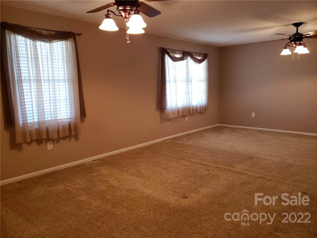 5418 East Lawyers Road Wingate, NC 28174 - Photo 19 of 40 a view of an empty room with a window