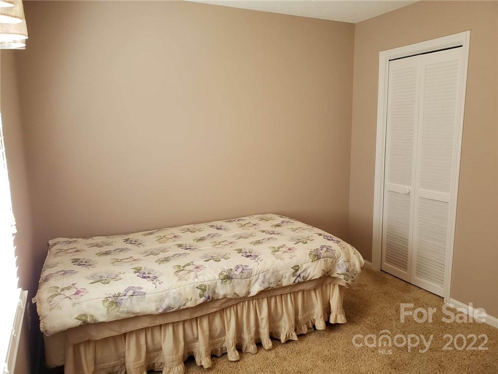 5418 East Lawyers Road Wingate, NC 28174 - Photo 27 of 40 a bedroom with a bed in it