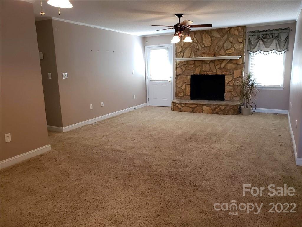 5418 East Lawyers Road Wingate, NC 28174 - Photo 7 of 40 a view of empty room with fireplace