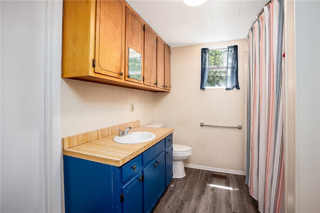 59 Church Street Notasulga, AL 36866 - Photo 12 of 38 Functional bathroom with ample storage and easy-care surfaces.