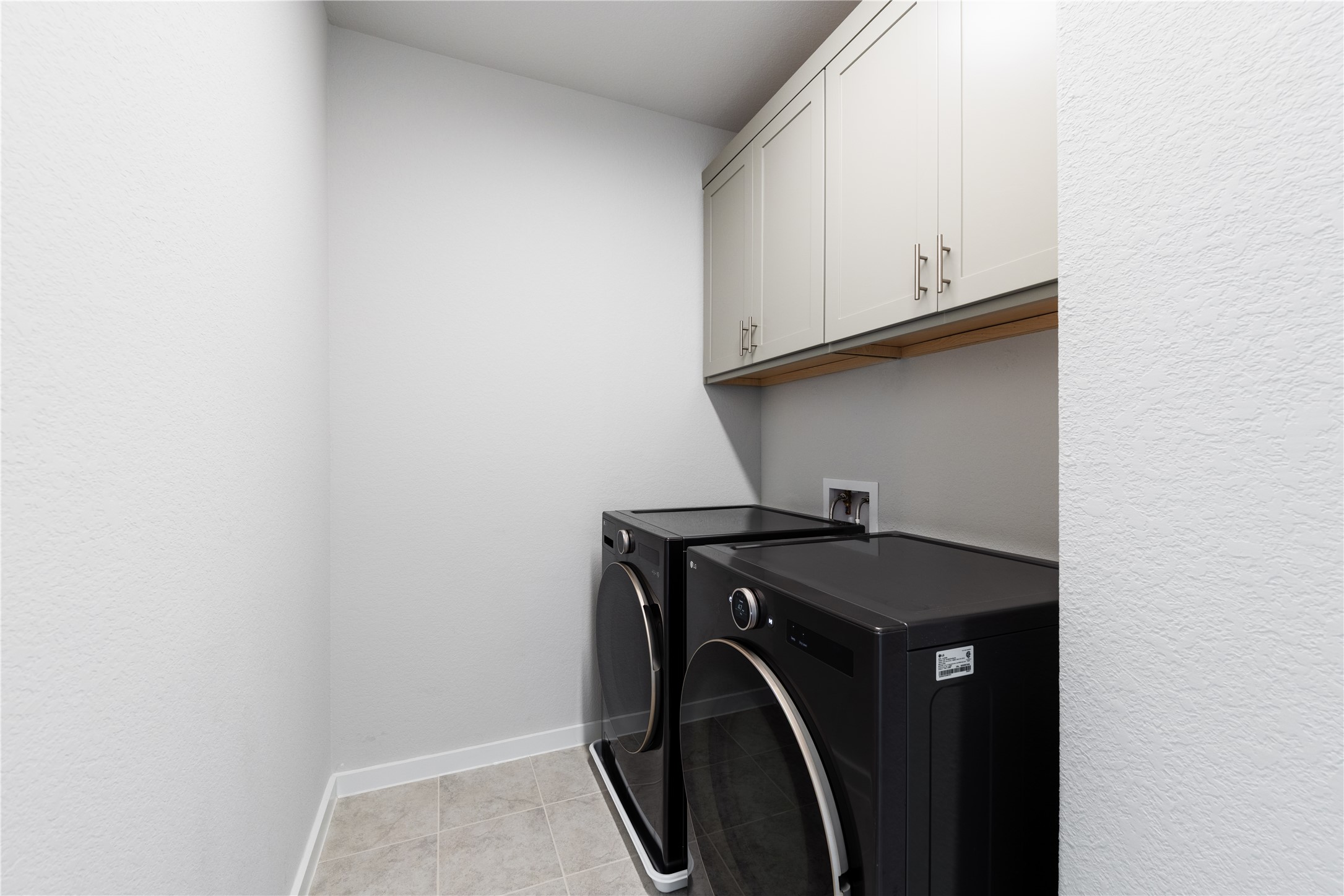 1209 Willie Rnch Way Leander, TX 78641 - Photo 15 of 37 a utility room with dryer and washer