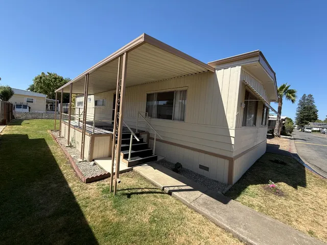 a house view with a backyard space