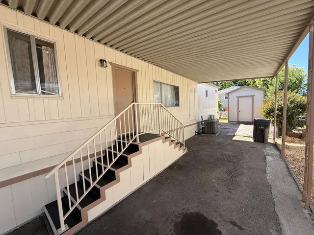 a view of staircase with wooden floor and windows