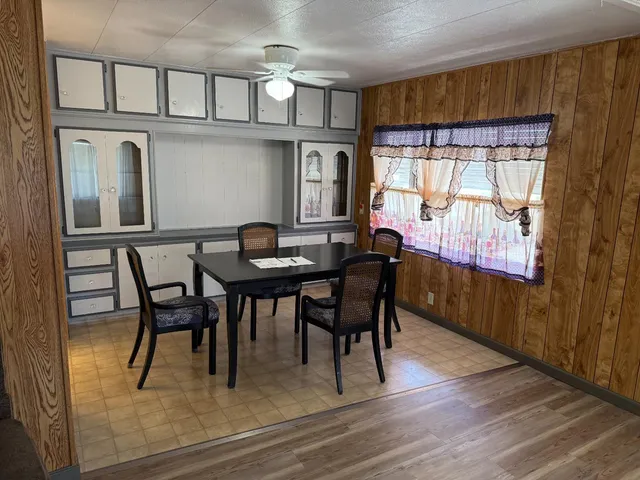 a dining room with furniture and window