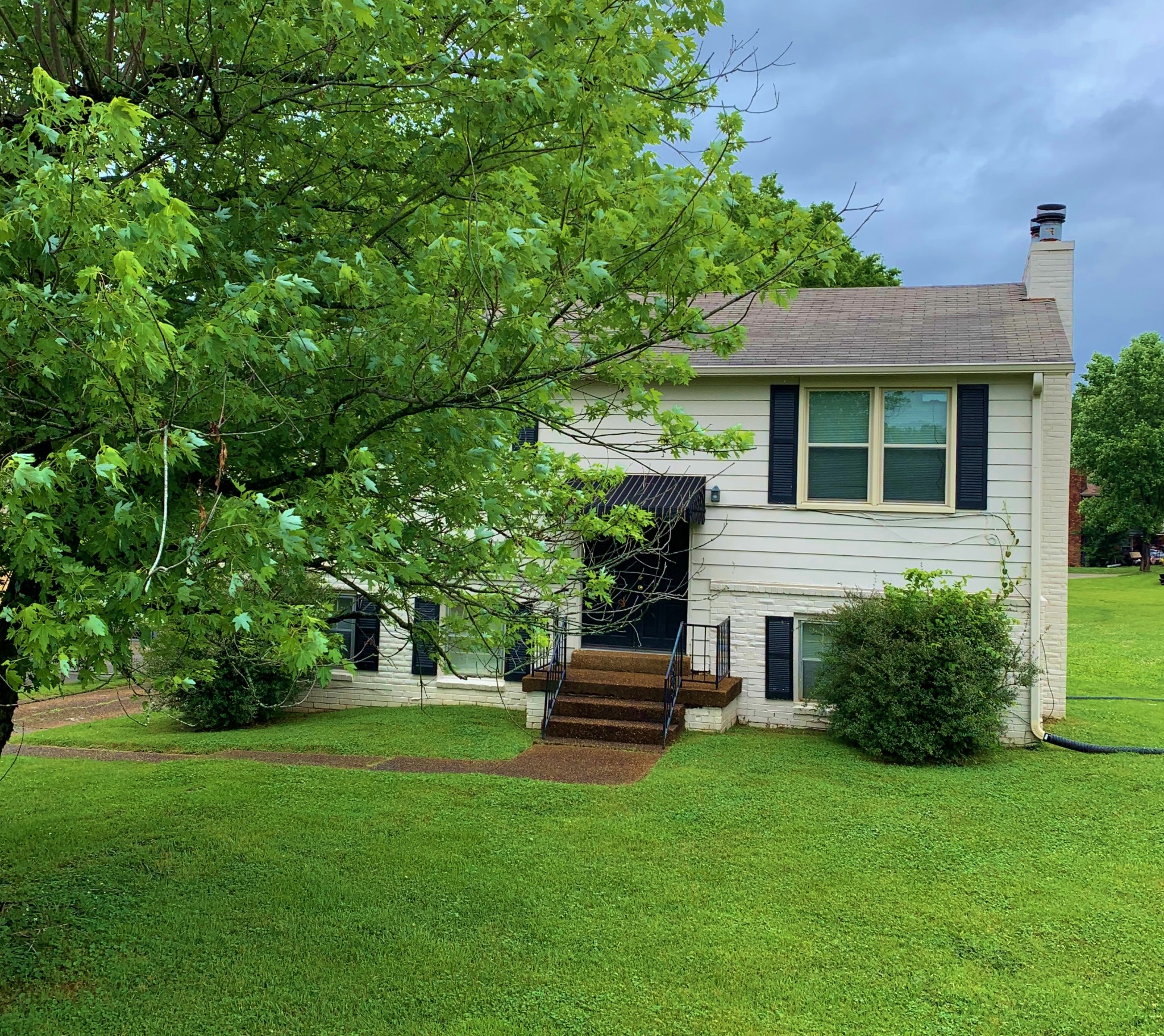 3060 Anderson Road Nashville, TN 37217 - Photo 2 of 43 a front view of a house with a garden