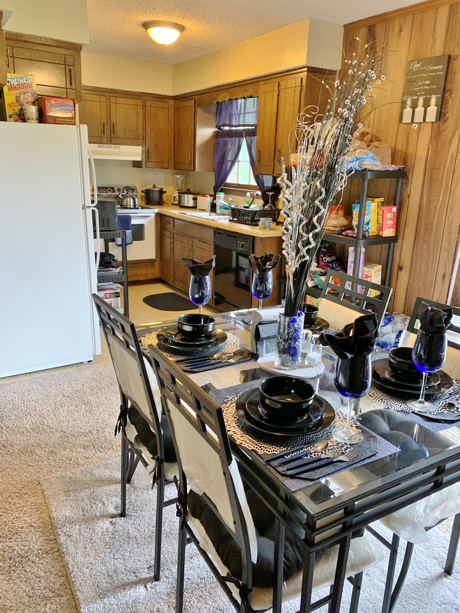 3060 Anderson Road Nashville, TN 37217 - Photo 16 of 43 a kitchen with a table and chairs stove and white cabinets
