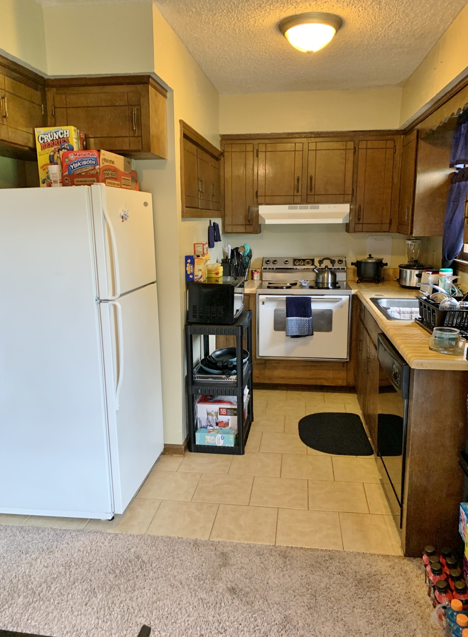 3060 Anderson Road Nashville, TN 37217 - Photo 19 of 43 a kitchen with refrigerator and cabinets