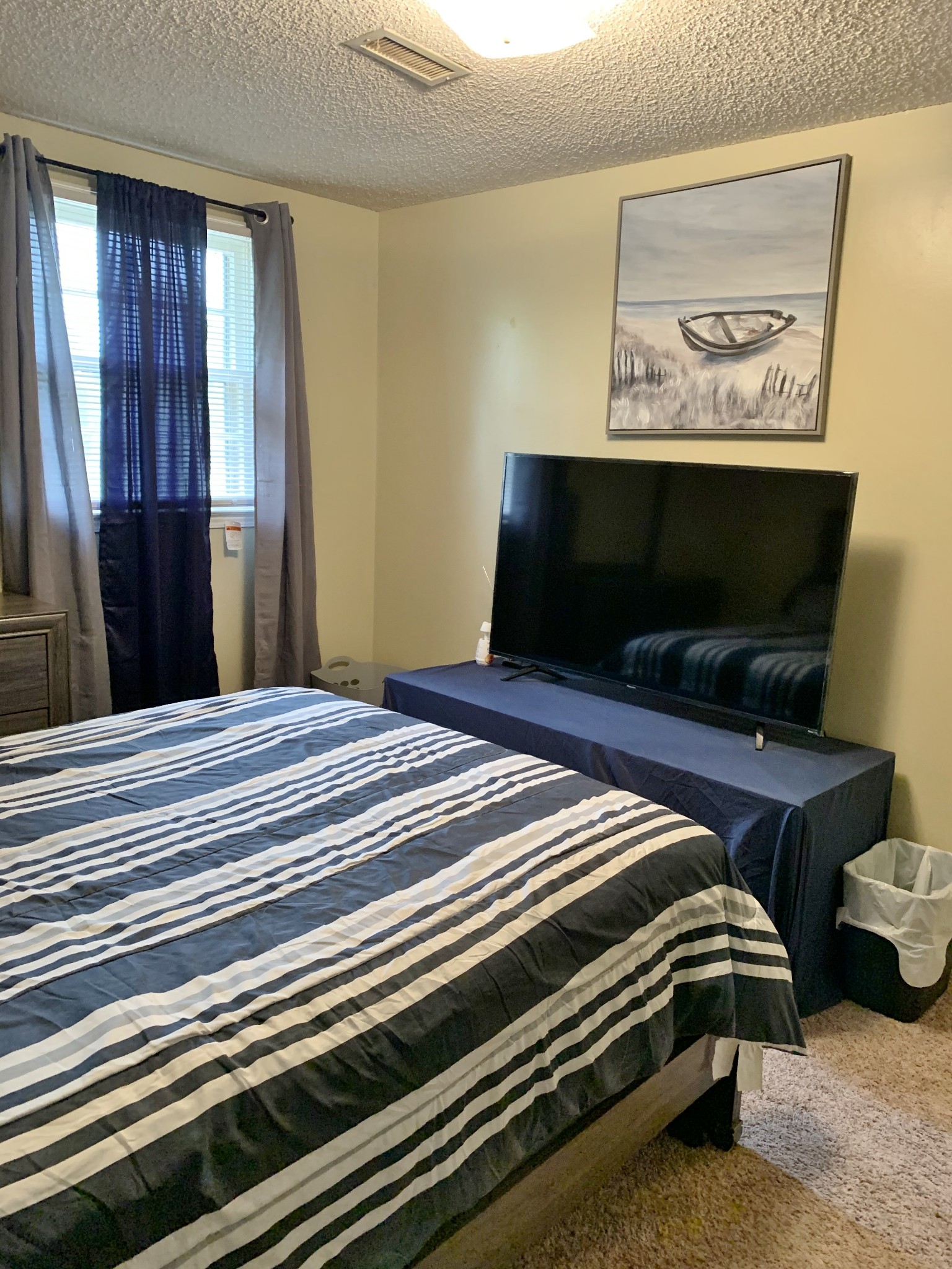3060 Anderson Road Nashville, TN 37217 - Photo 31 of 43 a bedroom with a bed and a flat screen tv