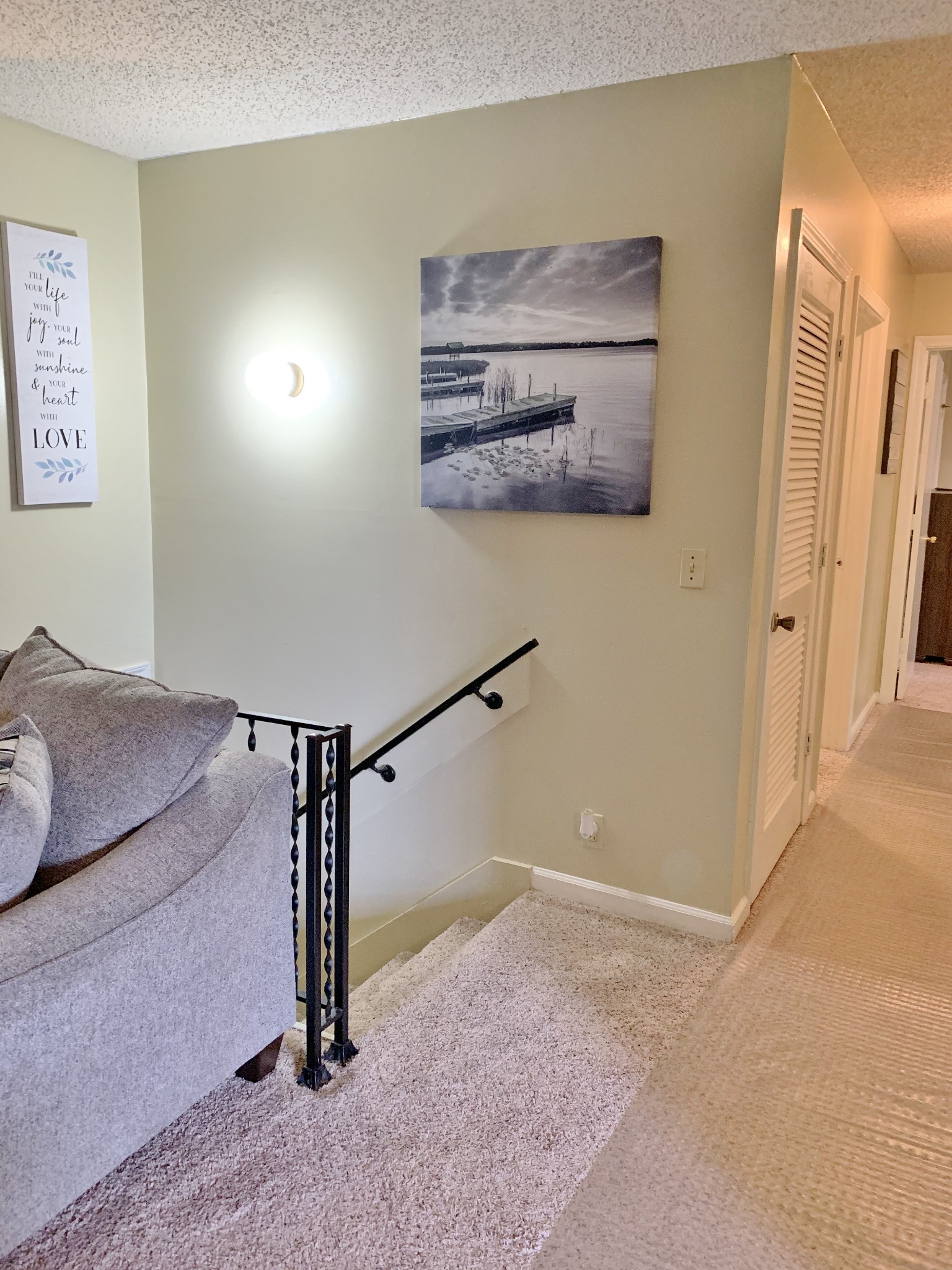 3060 Anderson Road Nashville, TN 37217 - Photo 7 of 43 a view of a hallway with paintings on the wall