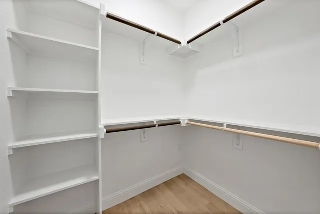 a view of an empty walk in closet