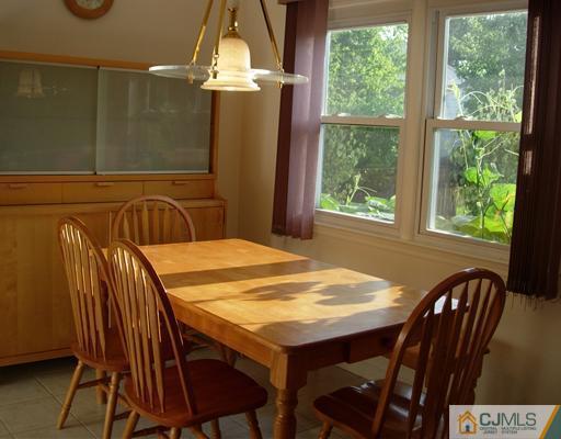 69 Dellwood Road Edison, NJ 08820 - Photo 4 of 9 a dining room with furniture and window