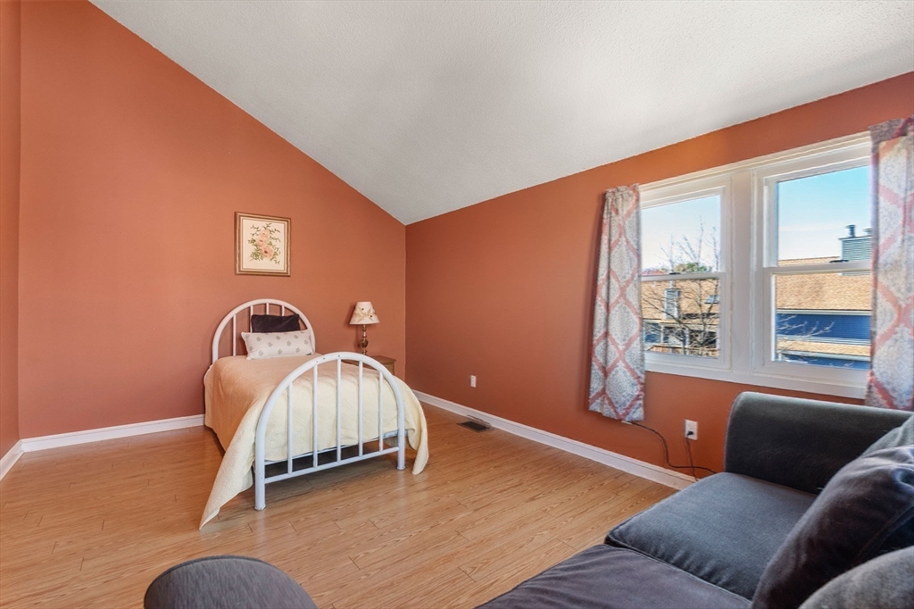 1 Spruance Way, Unit D Salem, MA 01970 - Photo 16 of 22 a bedroom with a bed and window