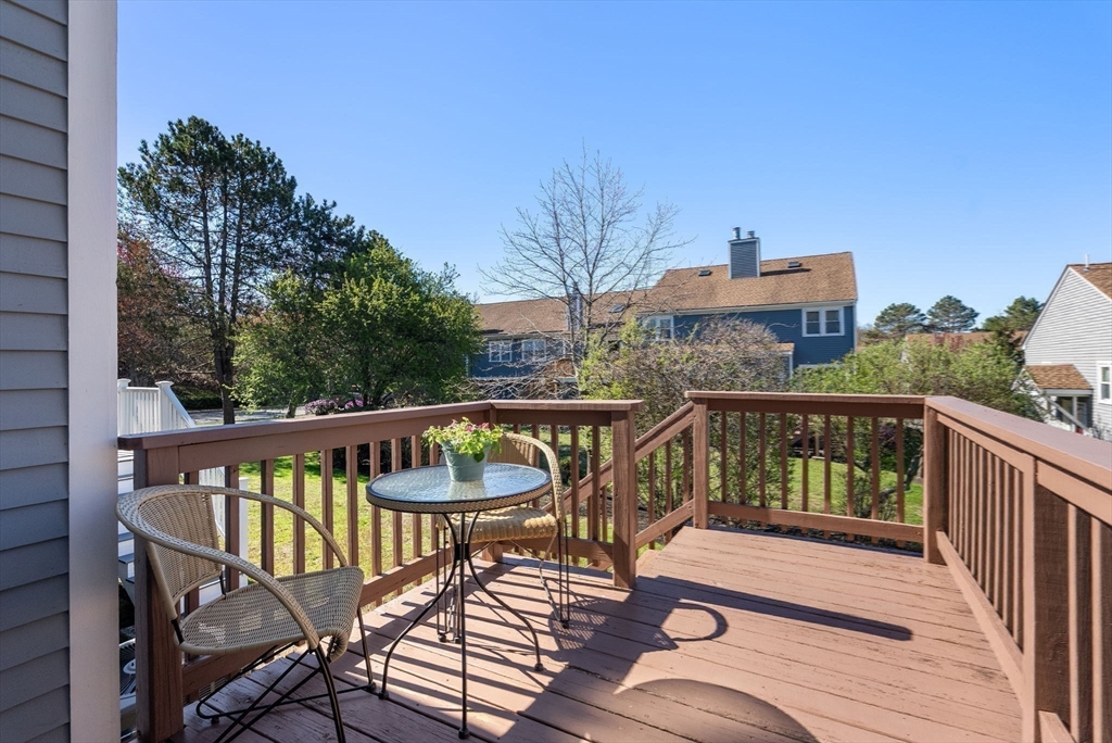 1 Spruance Way, Unit D Salem, MA 01970 - Photo 18 of 22 a view of a balcony with wooden floor and outdoor seating