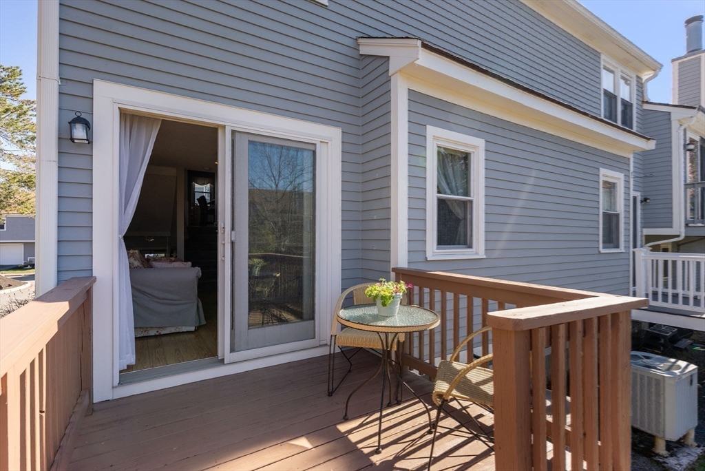 1 Spruance Way, Unit D Salem, MA 01970 - Photo 19 of 22 a outdoor seating area with furniture and window