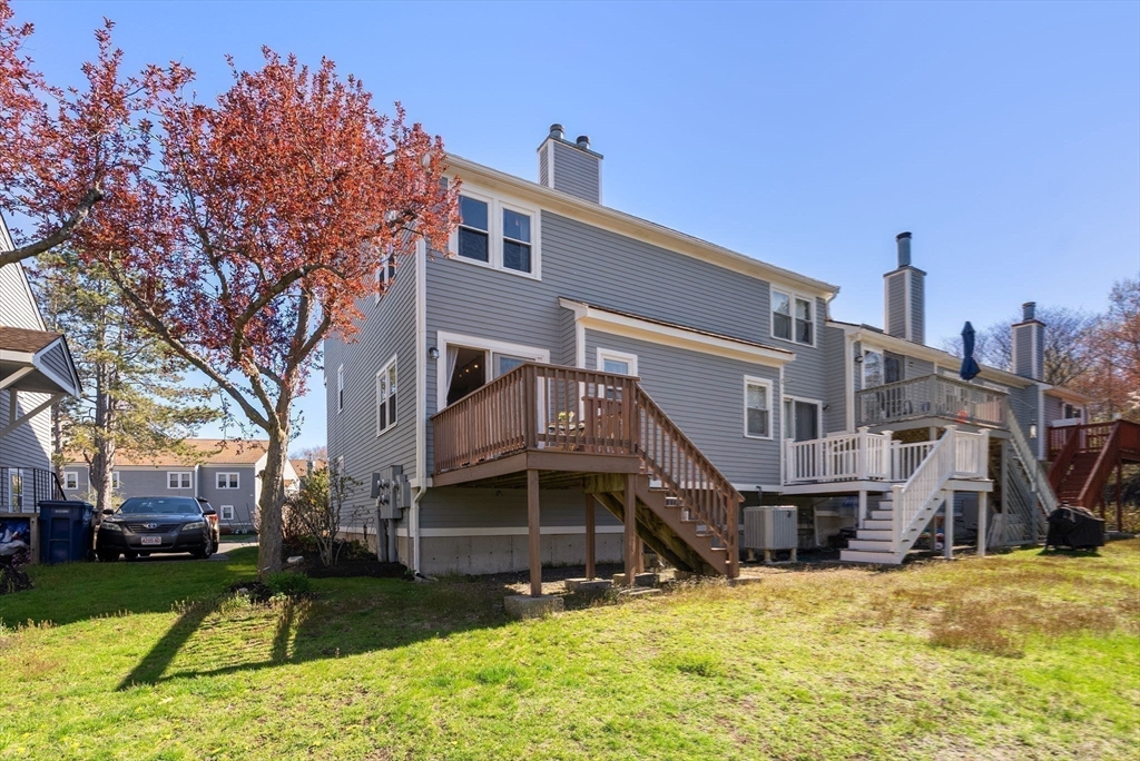 1 Spruance Way, Unit D Salem, MA 01970 - Photo 20 of 22 a view of a house with a yard