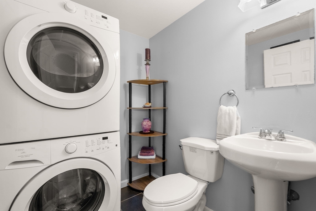 1 Spruance Way, Unit D Salem, MA 01970 - Photo 8 of 22 a bathroom with a sink mirror and toilet
