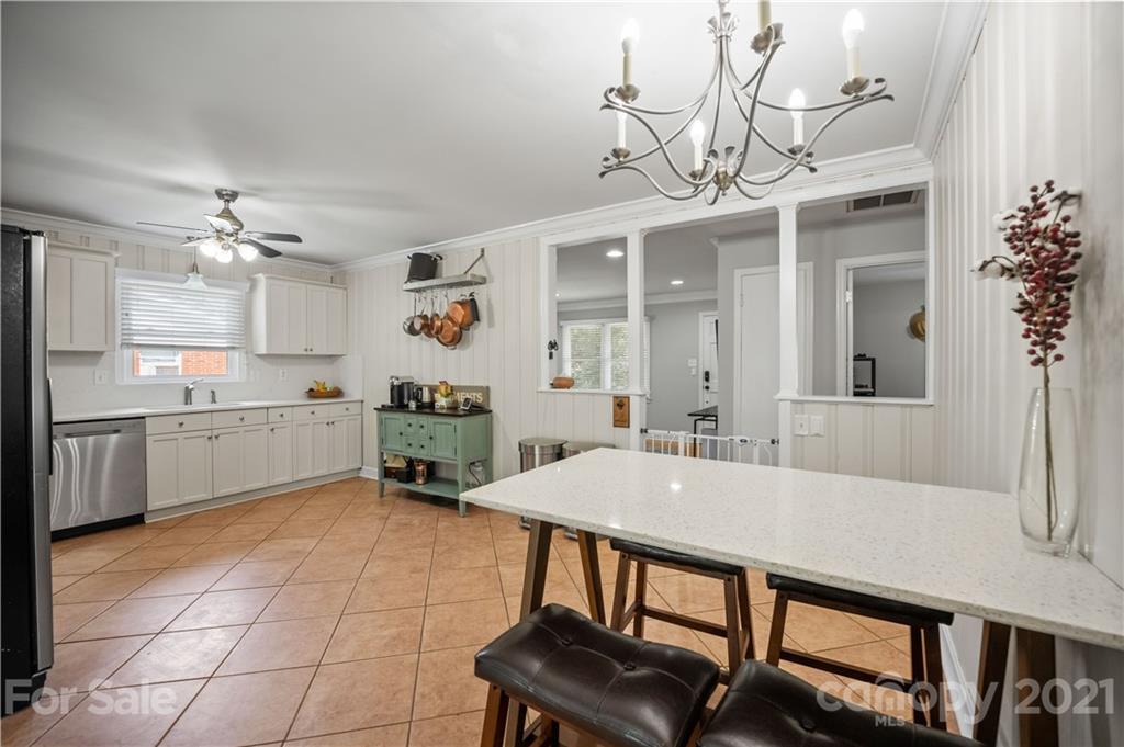 3854 Litchfield Road Charlotte, NC 28211 - Photo 12 of 35 a open kitchen with a table and chairs