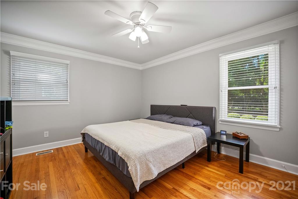 3854 Litchfield Road Charlotte, NC 28211 - Photo 16 of 35 a bedroom with a bed and a window