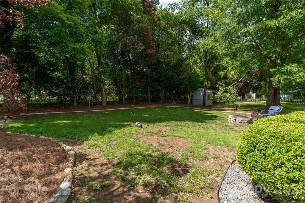 3854 Litchfield Road Charlotte, NC 28211 - Photo 23 of 35 a view of a park with large trees