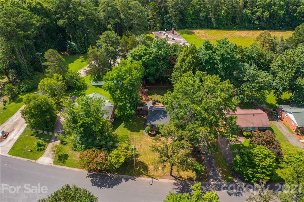 3854 Litchfield Road Charlotte, NC 28211 - Photo 33 of 35 an aerial view of a house with a yard and lake view