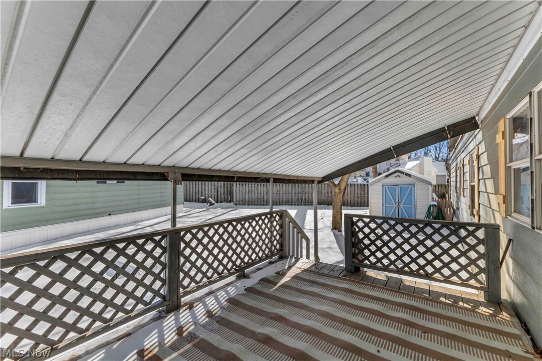 35157 Center Ridge Road, Unit 120 North Ridgeville, OH 44039 - Photo 21 of 25 Covered porch on the side of the home.