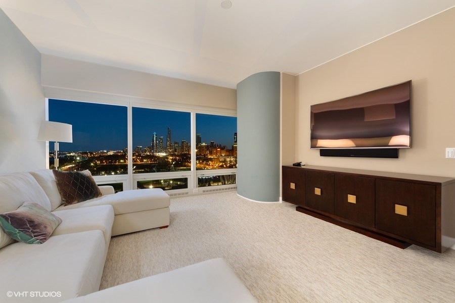 340 East Randolph Street, Unit 905 Chicago, IL 60601 - Photo 14 of 31 a living room with furniture and a flat screen tv