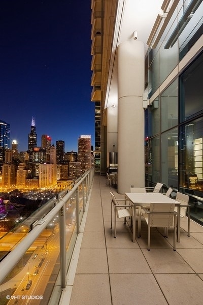 340 East Randolph Street, Unit 905 Chicago, IL 60601 - Photo 30 of 31 a swimming pool with outdoor seating and patio