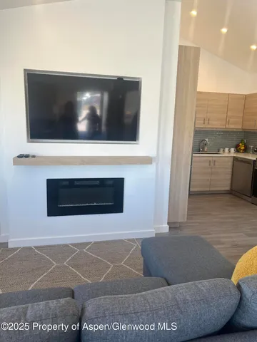 a living room with a couch and a fireplace