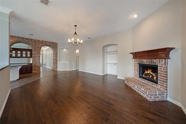 a large kitchen with stainless steel appliances and cabinets