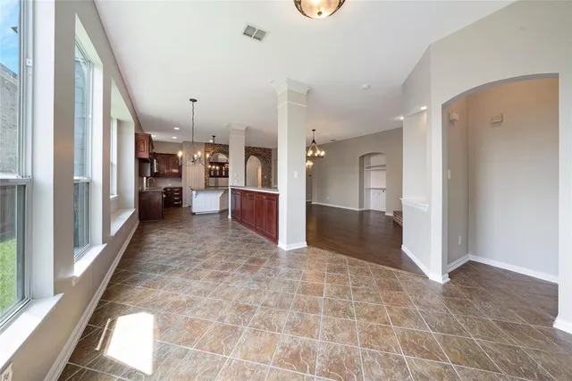 a kitchen with stainless steel appliances granite countertop a sink and a microwave
