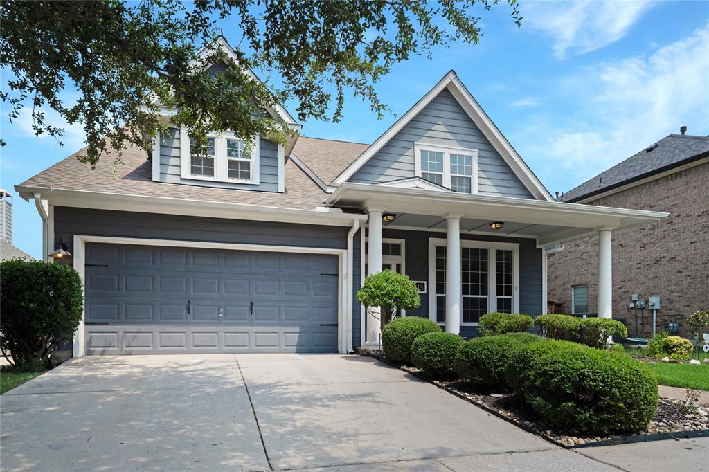 3418 Oakleigh Lane Frisco, TX 75033 - Photo 2 of 37 a front view of a house with a yard and garage