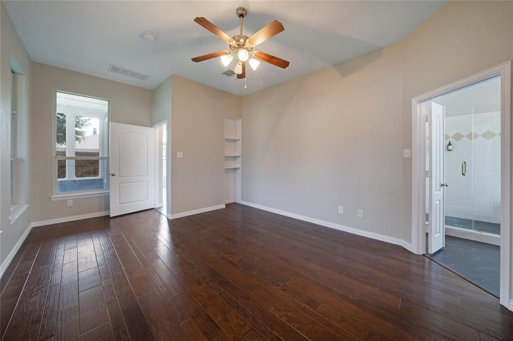 3418 Oakleigh Lane Frisco, TX 75033 - Photo 24 of 37 an empty room with wooden floor and a ceiling fan