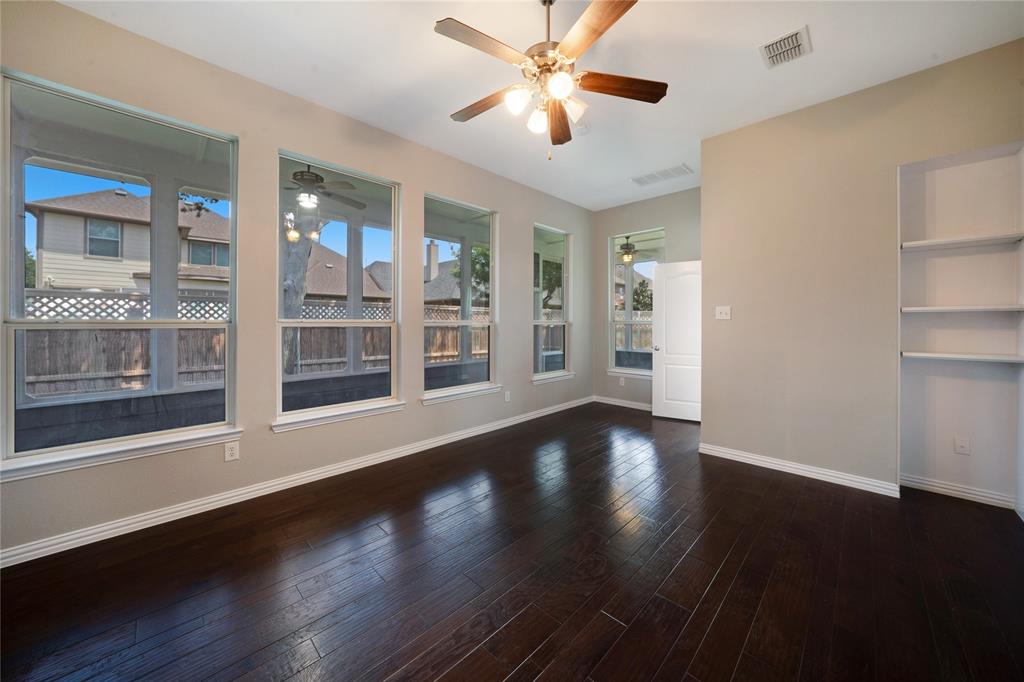 3418 Oakleigh Lane Frisco, TX 75033 - Photo 25 of 37 a view of an empty room with wooden floor and a window