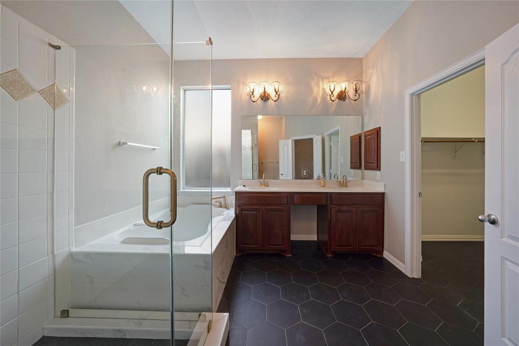 3418 Oakleigh Lane Frisco, TX 75033 - Photo 26 of 37 a bathroom with a double vanity sink and a mirror