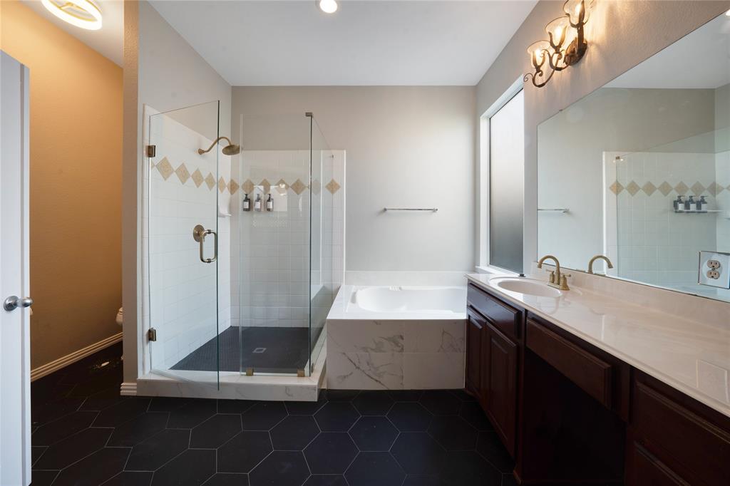 3418 Oakleigh Lane Frisco, TX 75033 - Photo 27 of 37 a bathroom with a double vanity sink a toilet and a mirror
