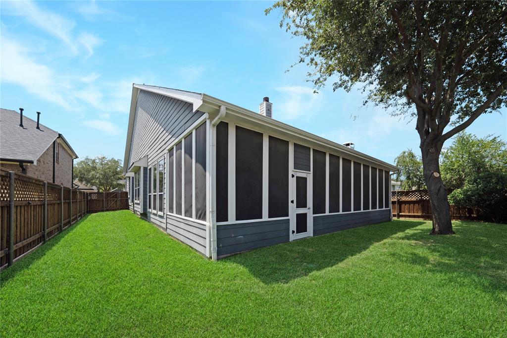 3418 Oakleigh Lane Frisco, TX 75033 - Photo 37 of 37 a view of a backyard with wooden fence and a large tree