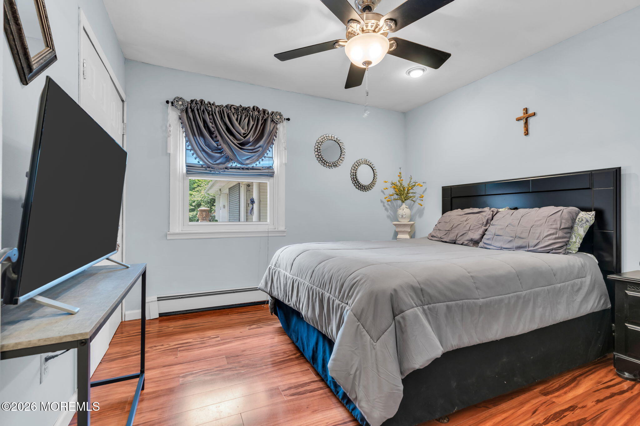 8 Owens Road Marlboro, NJ 07746 - Photo 25 of 39 a bedroom with a bed and a flat screen tv