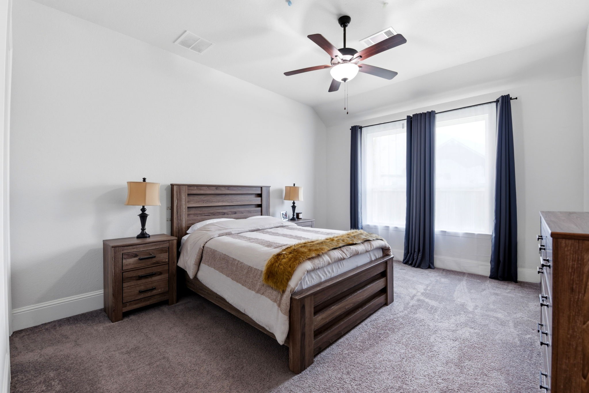 10062 South Goshawk Trail Conroe, TX 77385 - Photo 27 of 43 a bedroom with a bed and a ceiling fan