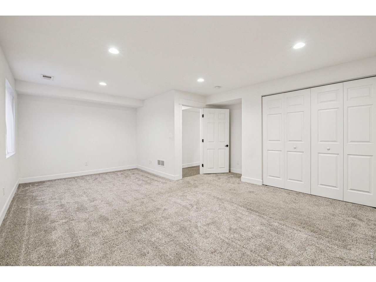302 Victoria Street Berthoud, CO 80513 - Photo 20 of 25 Large Basement 3rd Bedroom