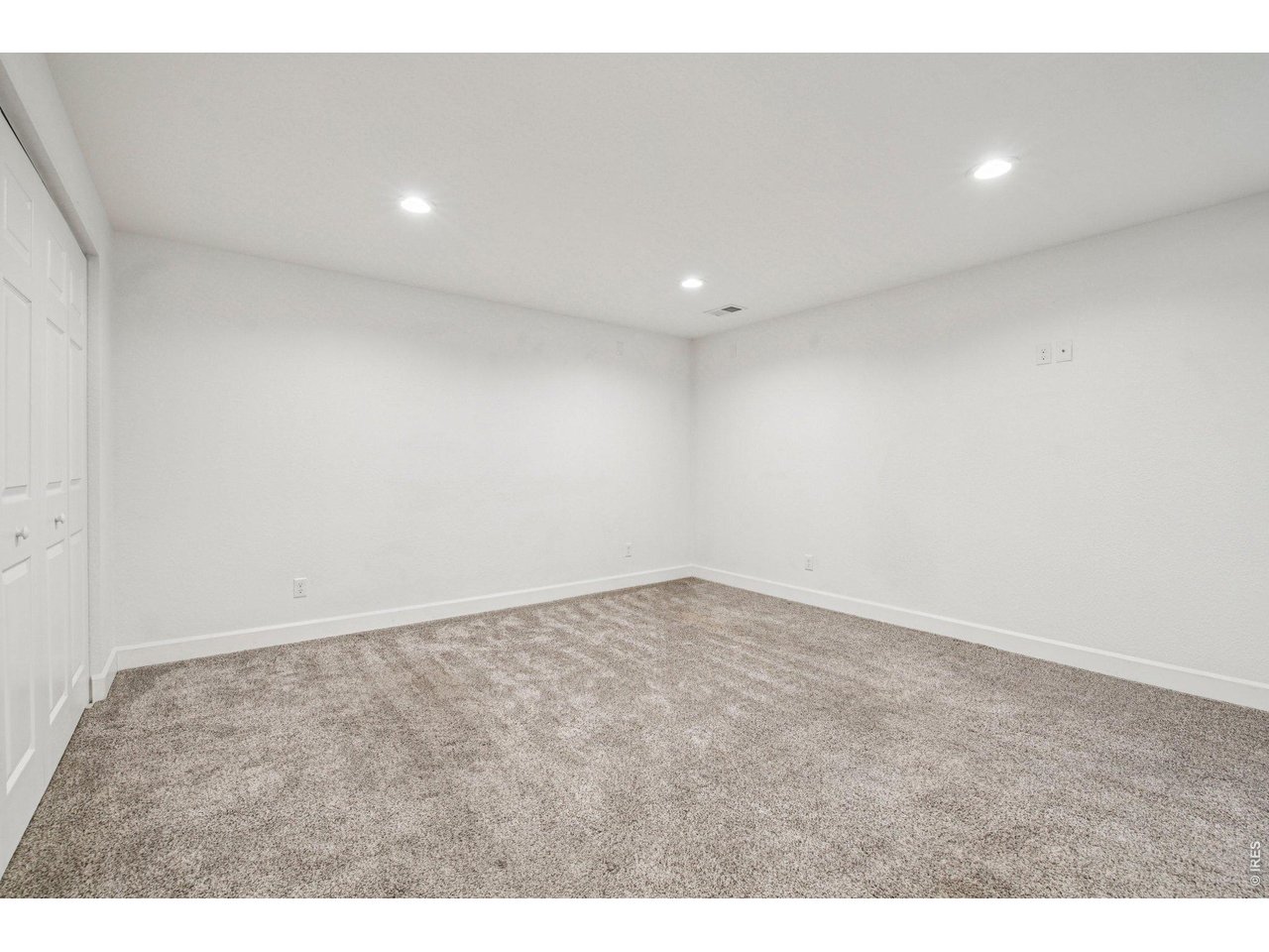302 Victoria Street Berthoud, CO 80513 - Photo 21 of 25 Large Basement 3rd Bedroom