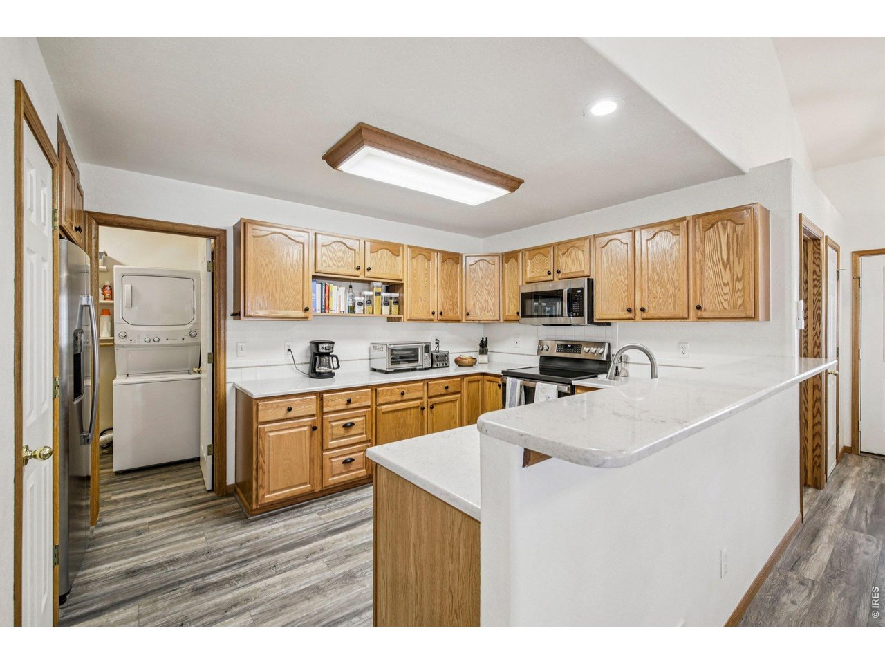 302 Victoria Street Berthoud, CO 80513 - Photo 8 of 25 Eat-In Kitchen with Bar Seating