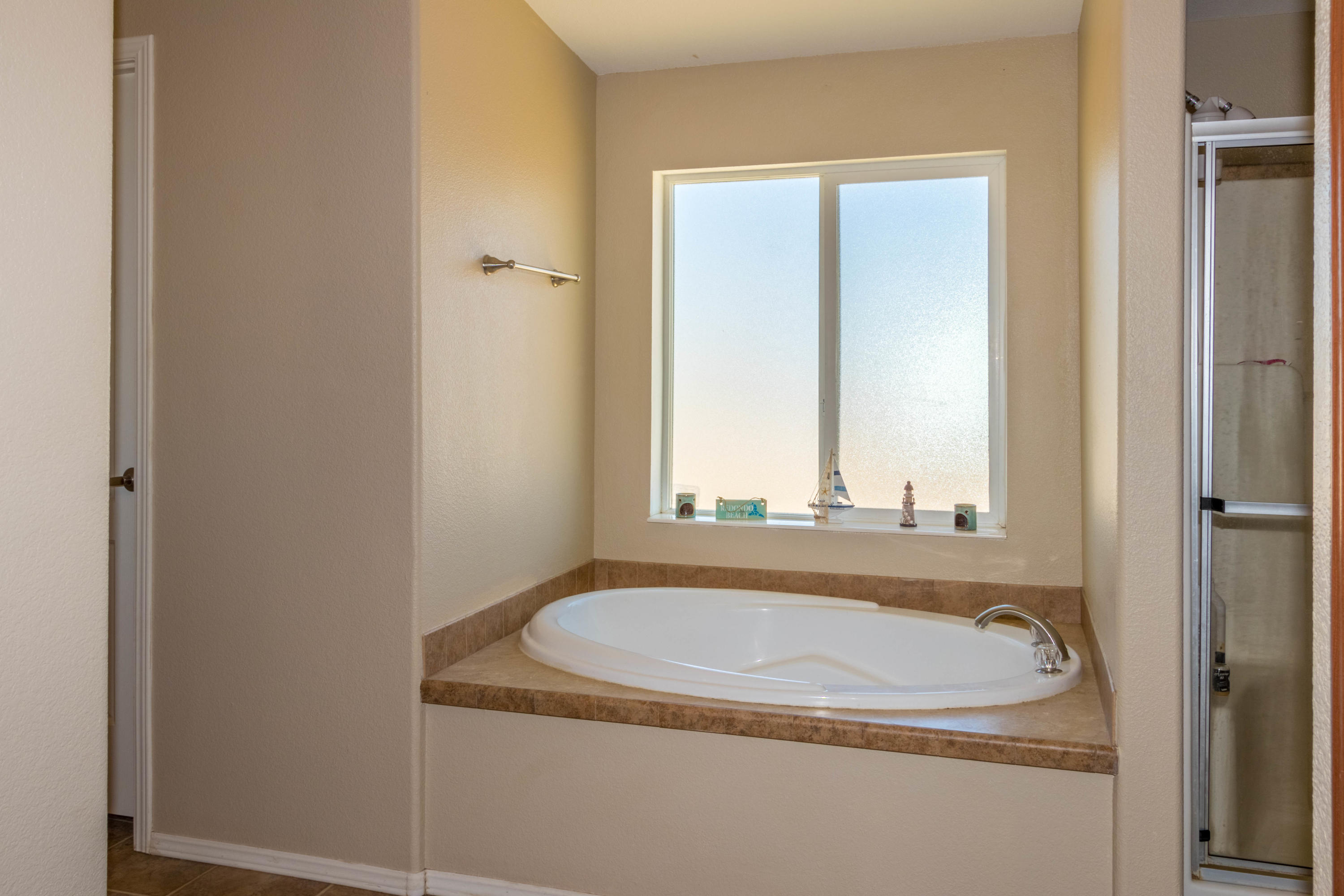 4403 Backus Road Mojave, CA 93501 - Photo 18 of 35 a bathroom with a granite countertop sink and a mirror