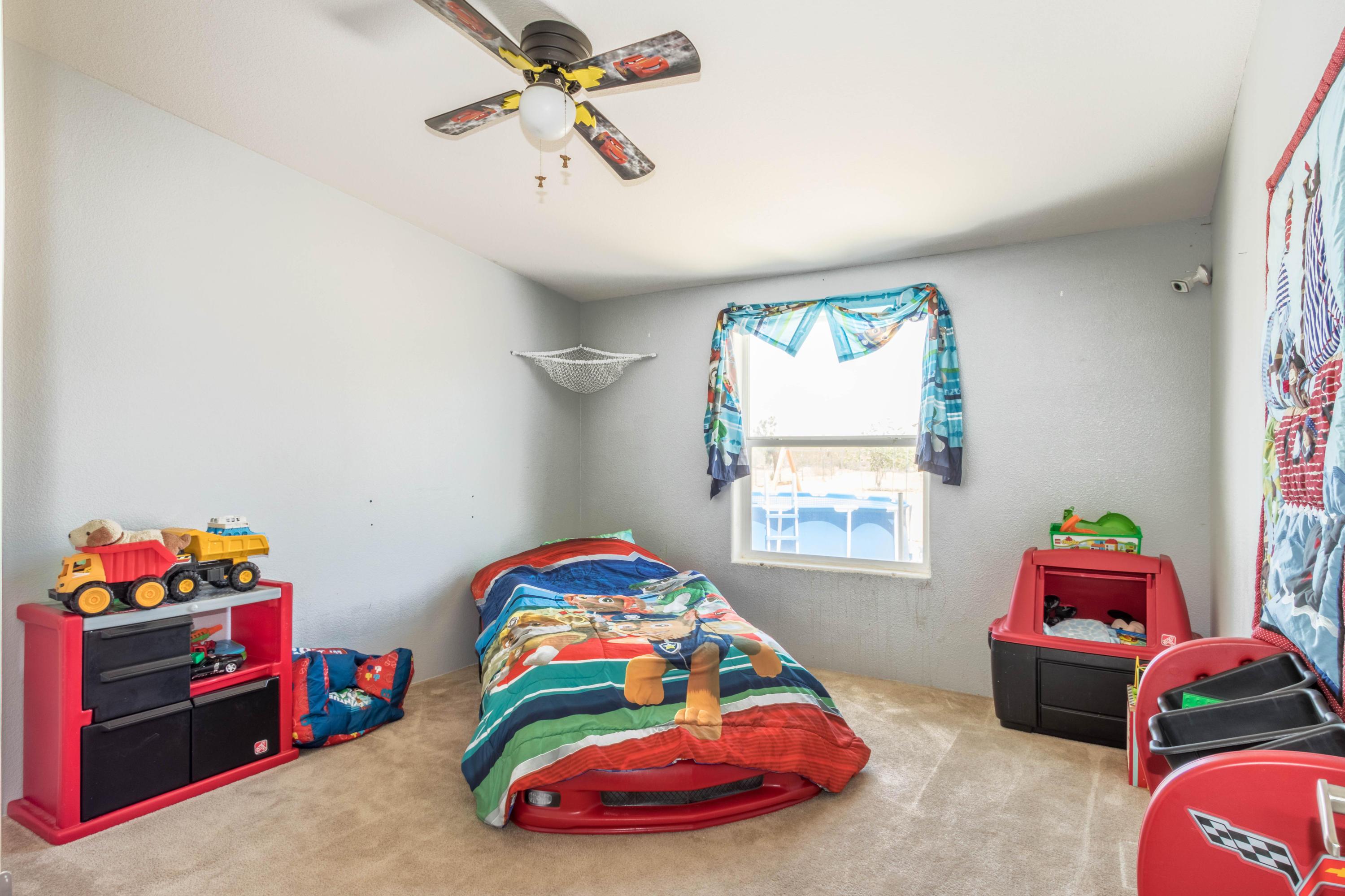 4403 Backus Road Mojave, CA 93501 - Photo 21 of 35 a bedroom with a bed and a window