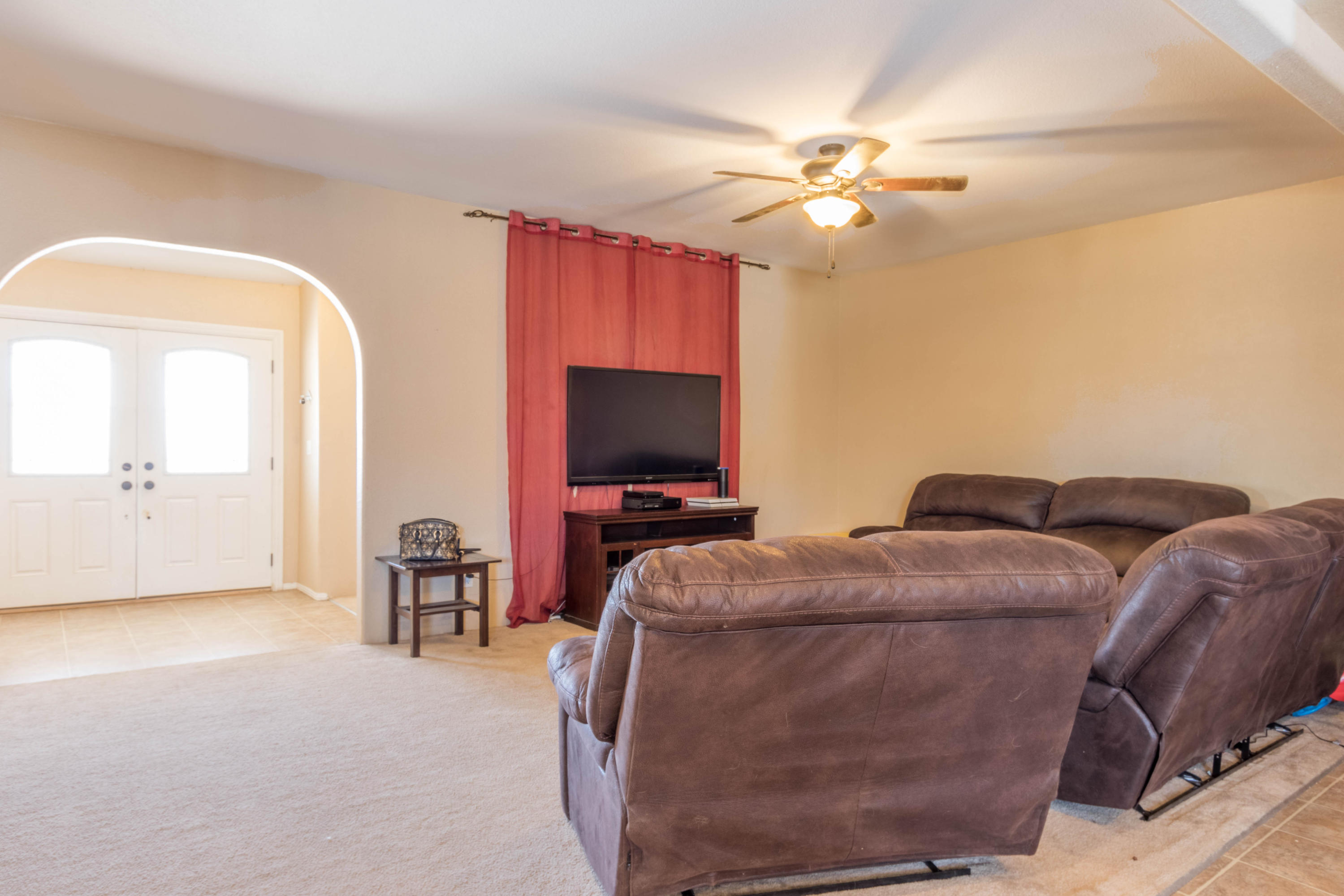 4403 Backus Road Mojave, CA 93501 - Photo 4 of 35 a living room with furniture and a flat screen tv