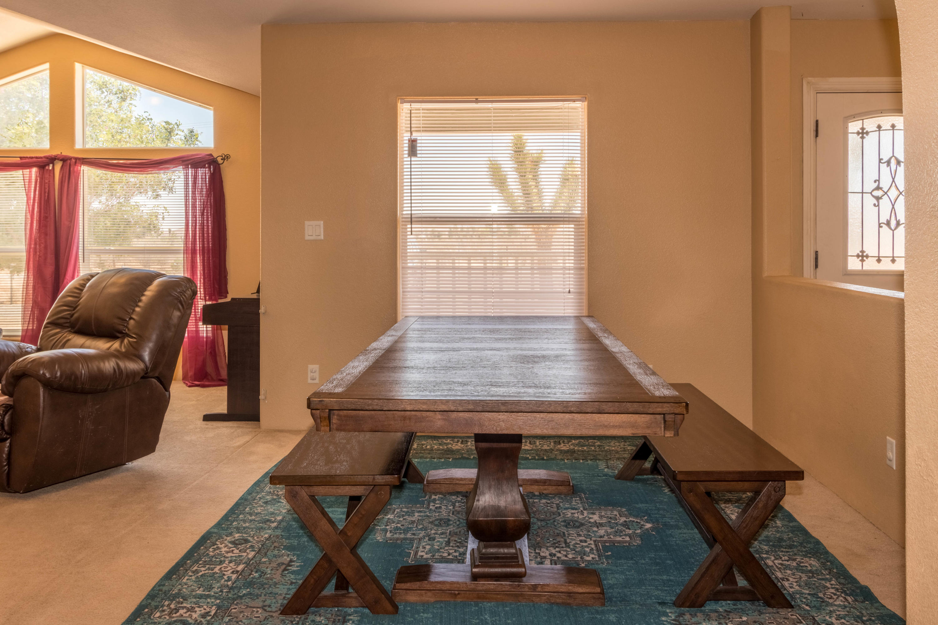 4403 Backus Road Mojave, CA 93501 - Photo 8 of 35 a living room with a table chairs and a window