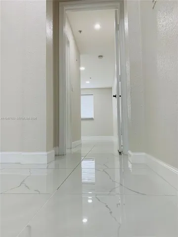 an empty room with white walls