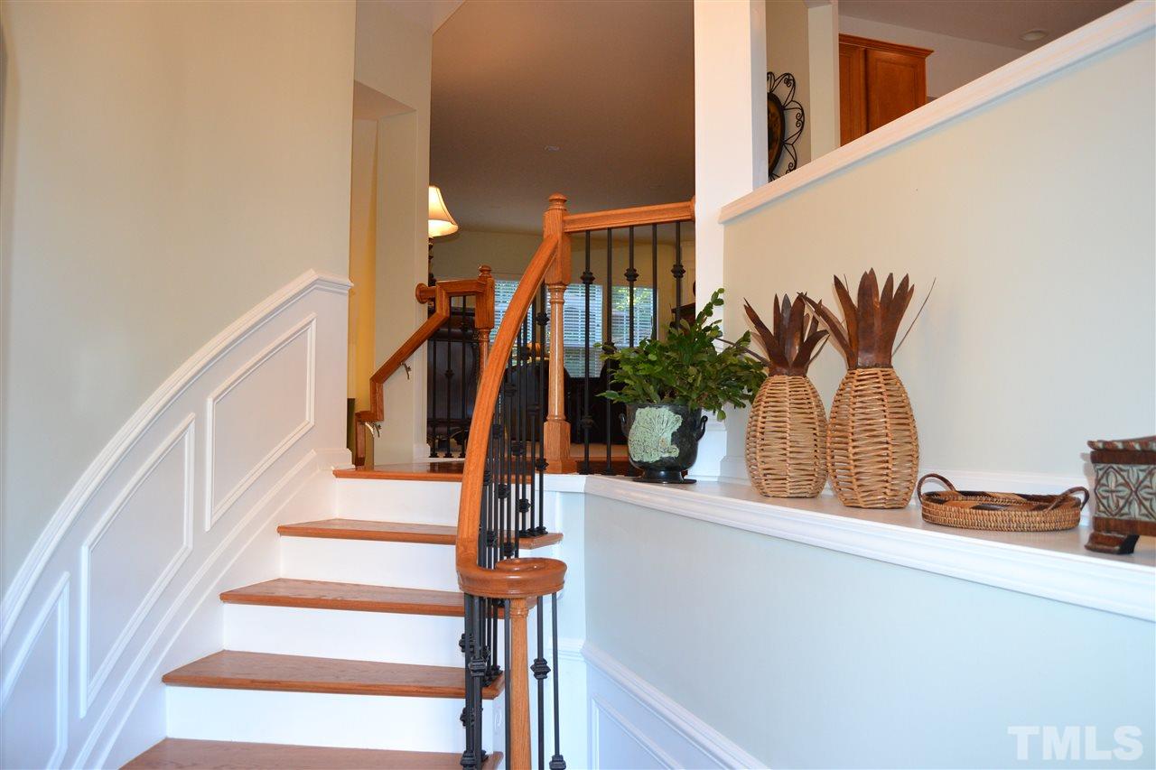 4725 Mifflin Street Raleigh, NC 27612 - Photo 3 of 25 Gorgeous curved entry stairs with wrought iron spindles and oak treads.